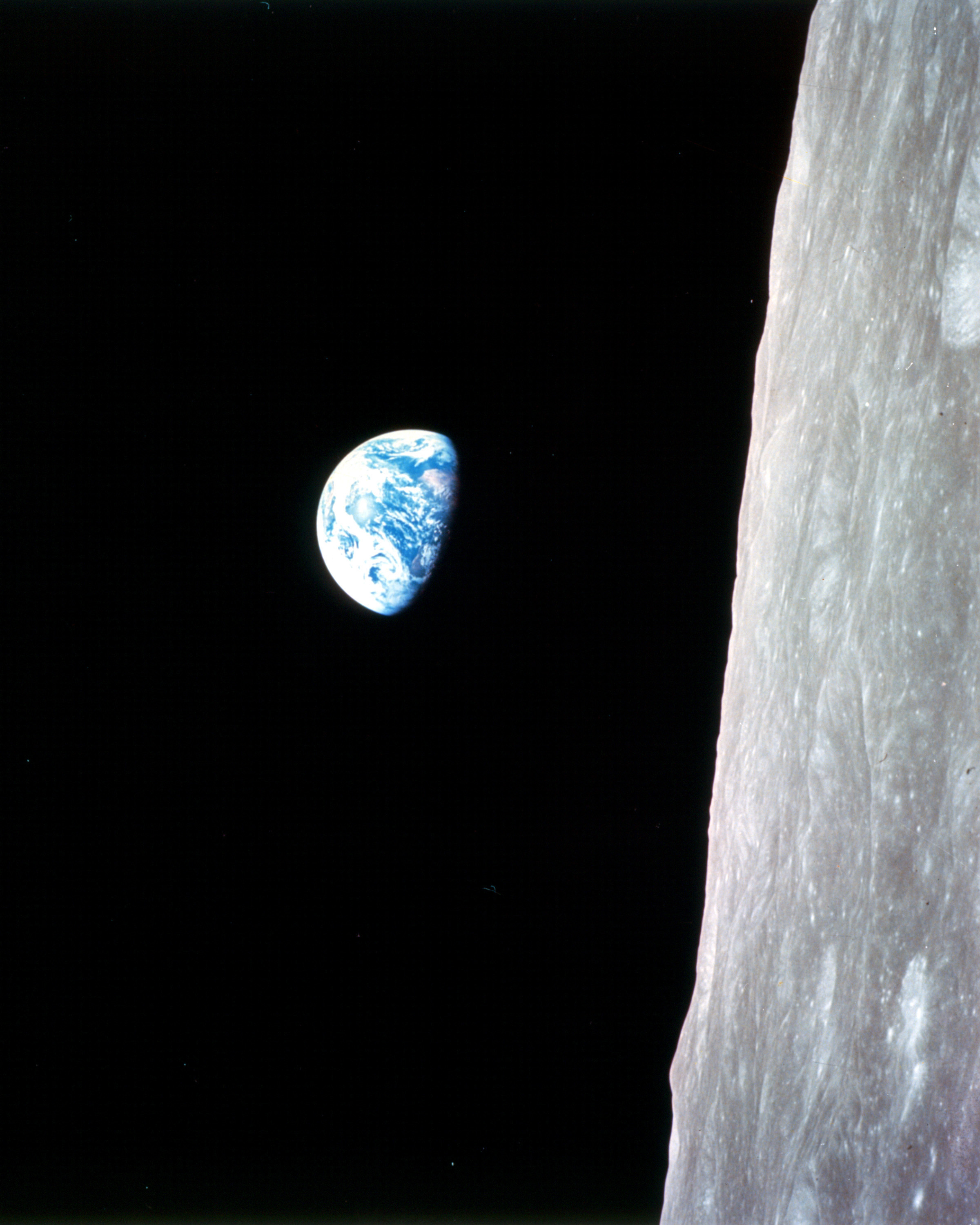 Earth rising over the Moon. Apollo 8, NASA, 24 December 1968. Public domain.
